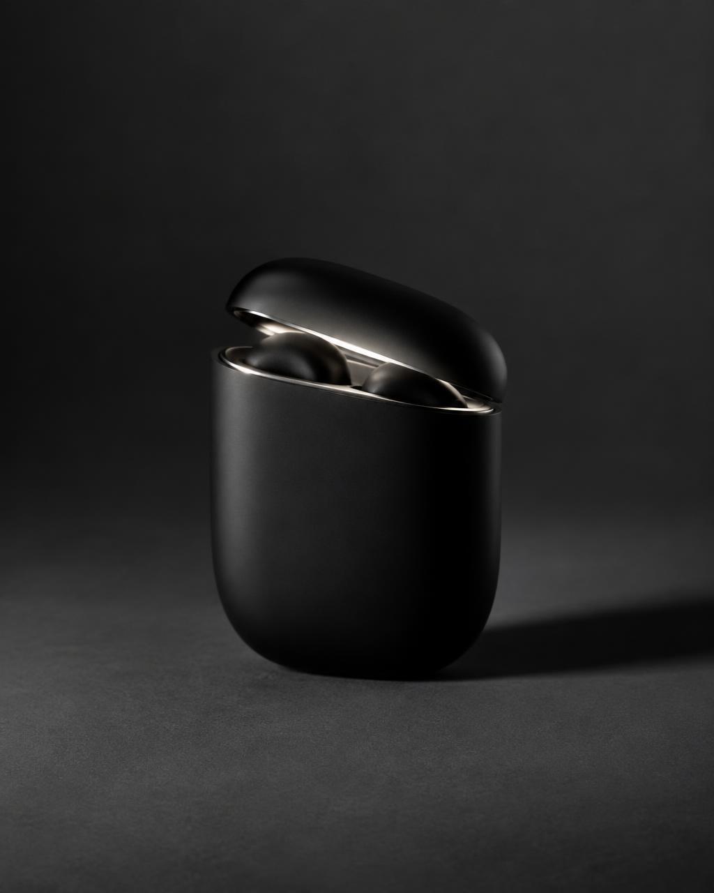 Charging case standing upright with the lid ajar